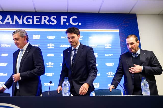 From left, Andrew Cavenagh, Danny Rohl and Kevin Thelwell take their seats at a Rangers press conference.