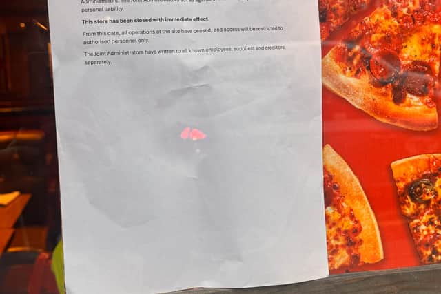 The sign displayed on the front of the Pizza Hut on Hanover Street in Edinburgh. 