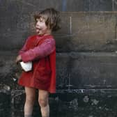 Girl at chalk-marked wall