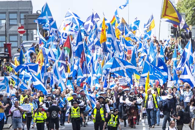 Scottish independence supporters march through Glasgow.