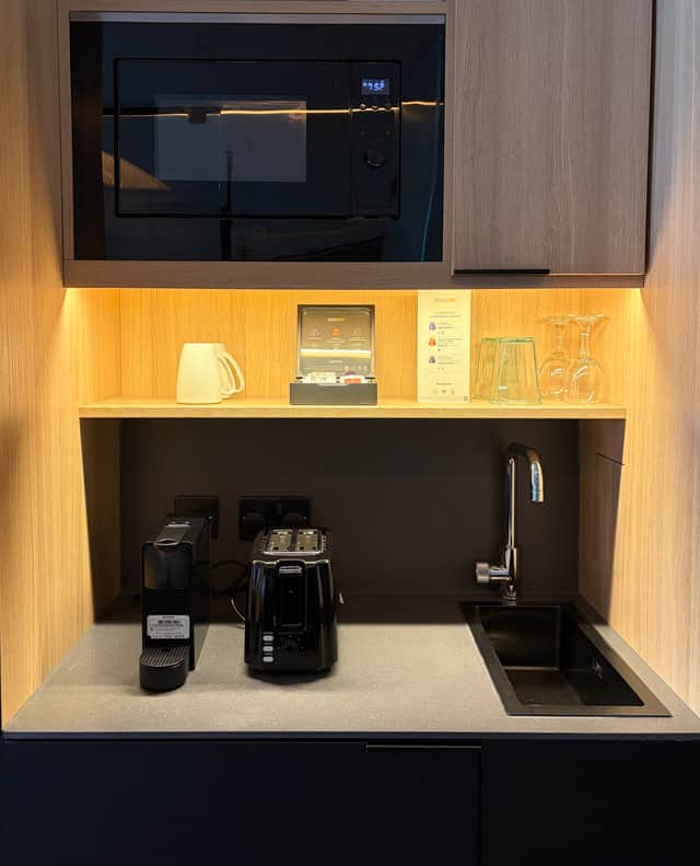 The kitchenette, with Nespresso machine and microwave.