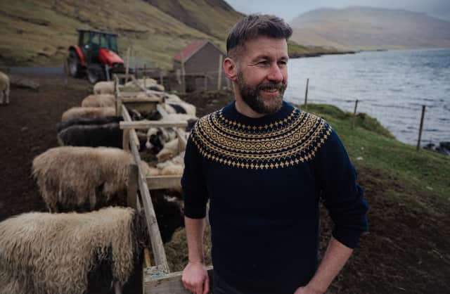 Coinneach MacLeod with sheep on the Faroe Islands, one of the stops on his Nordic Islands journey