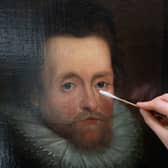 Restoration work is carried out on the portrait