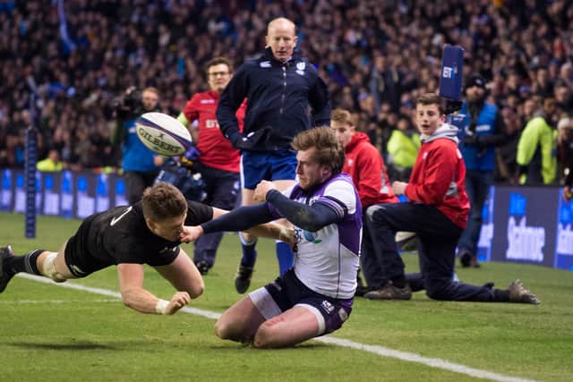 Scotland's Stuart Hogg (right) is tackled by Beauden Barrett late in the game to be denied a try in 2017.