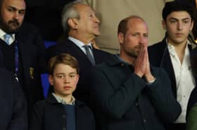 Prince George and Prince William pictured during the football match between Paris Saint-Germain and Aston Villa FC at the Parc des Princes earlier this year (Picture: Carl Recine)
