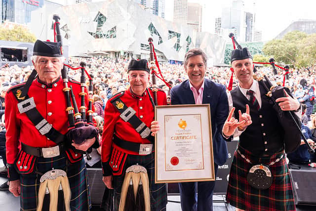 The world record was smashed by the pipers in Melbourne, with the city's lord mayor, Nicholas Reece, presenting the band leaders with the certificate. Picture: Asanka Ratnayake/Getty Images