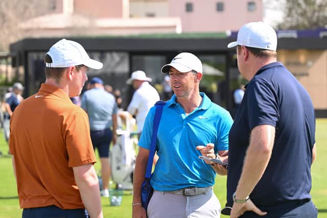 Race to Dubai leader Rory McIlroy chats to Bob MacIntyre and the Scot’s  caddie Mike Burrow on the practice range at Jumeirah Golf Estates