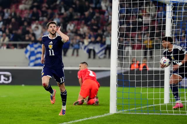 Ryan Christie celebrates after heading home for Scotland.