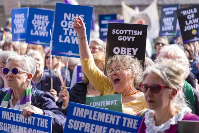 Campaigners from For Women Scotland outside Scottish Parliament in Edinburgh holding a demonstration urging the Scottish Government to implement the Supreme Court ruling on gender