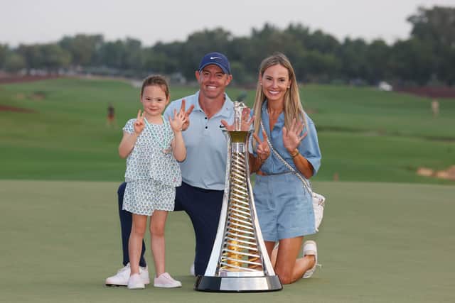 Rory McIlroy celebrates winning a seventh Race to Dubai title with daughter Poppy and wife Erica at Jumeirah Golf Estates in Dubai,