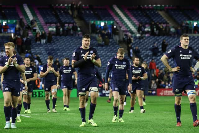 Scotland's despondent players trudge around Murrayfield after defeat by Argentina.