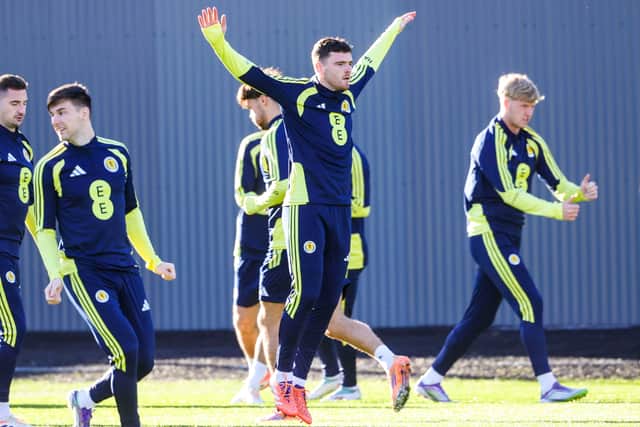 Andy Robertson and Scotland train ahead of Tuesday's must-win clash with Denmark at Hampden.