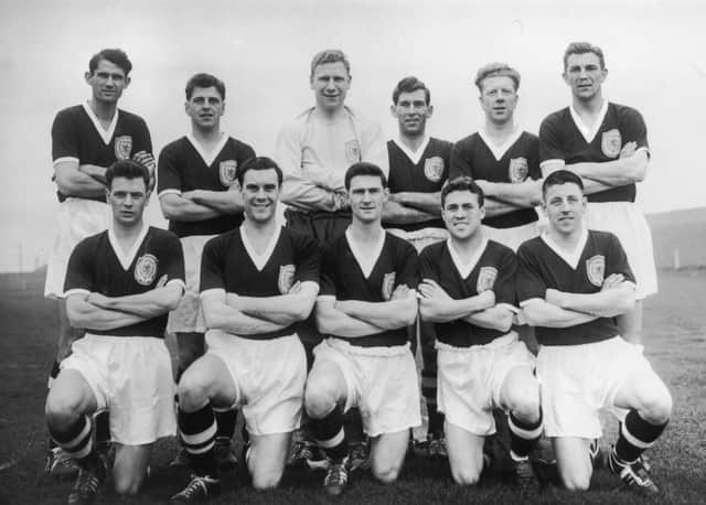 The Scotland football team set to take part in the World Cup in Sweden, 1958. From left to right, (back row) John Davidson Hewie, Eric Caldow, Thomas Younger, Edward Hunter Turnbull, Robert Evans and Douglas Cowie; (front row) Graham Leggat, James Murray, John Knight Mudie, Robert Young Collins and James John Stewart Imlach.