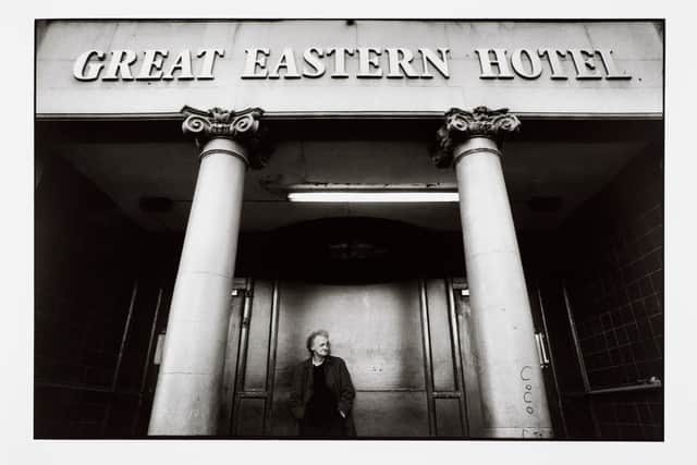 Man standing in entrance to Great Eastern Hotel, 1994