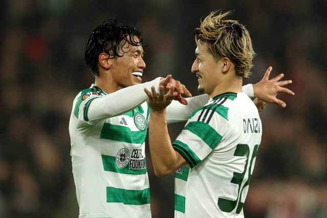 Reo Hatate celebrates with teammate Daizen Maeda after putting Celtic 2-1 in front against Feyenoord.