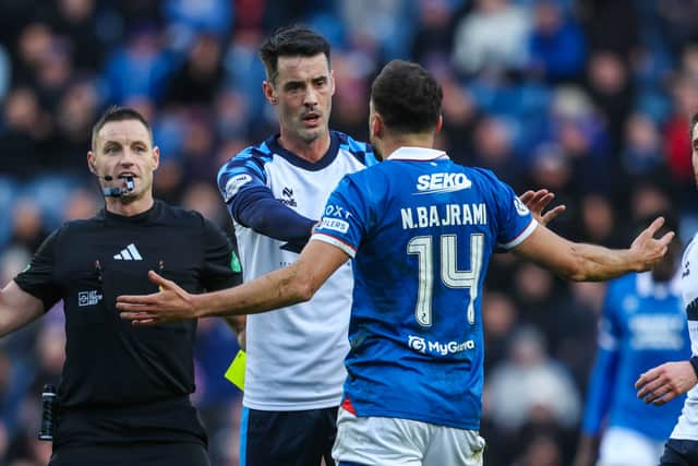 Rangers' Nedim Bajrami (R) remonstrates with Falkirk's Brian Graham (L) during the goalless draw at Ibrox. (Photo by Craig Foy / SNS Group)