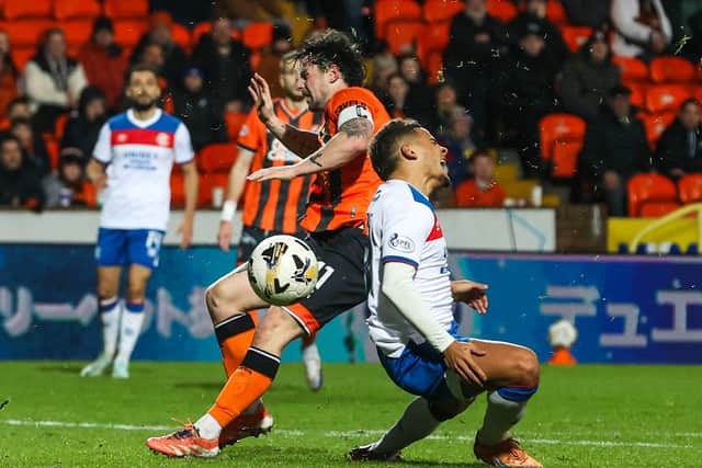 Will Ferry fouls Max Aarons for Rangers' last-gasp penalty at Tannadice.