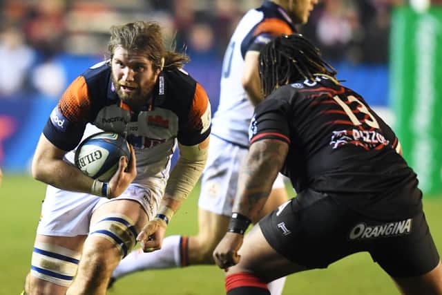 Edinburgh's Ben Toolis takes on Toulon's Mathieu Bastareaud during the Champions Cup win in France.