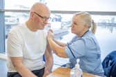 First Minister John Swinney receives his winter flu vaccination at Ocean Terminal, Leith, in Edinburgh