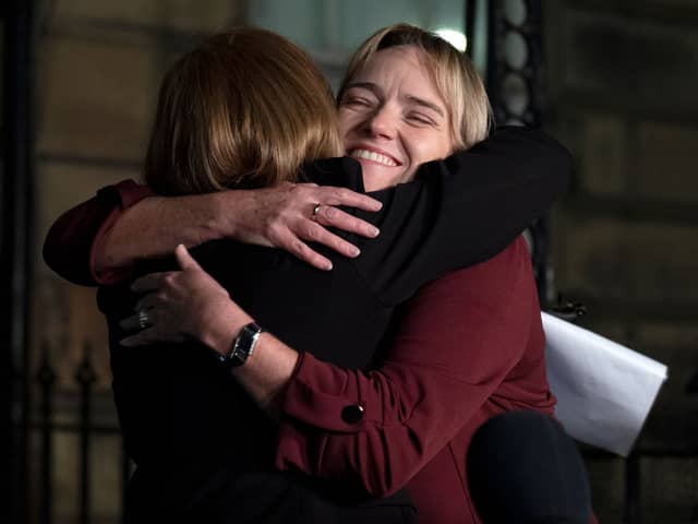 Nurse Sandie Peggie hugs her solicitor Margaret Gribbon 