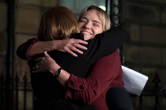 Nurse Sandie Peggie hugs her solicitor Margaret Gribbon