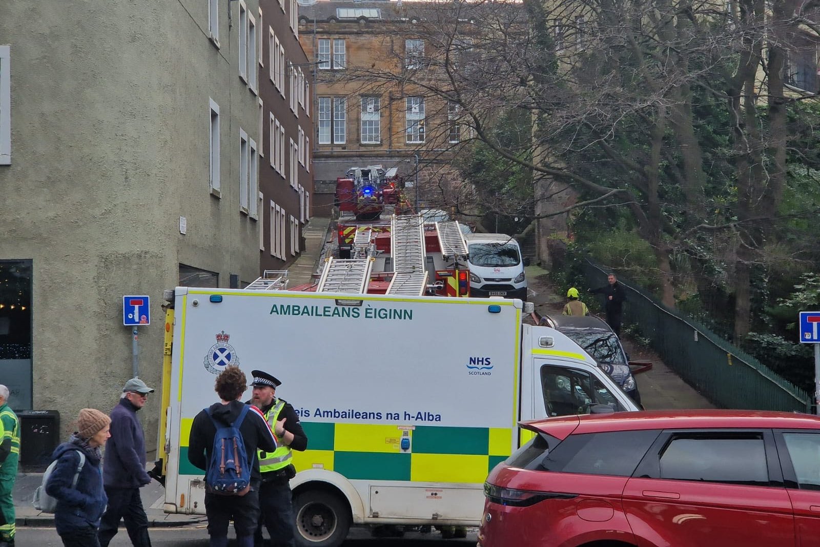 Two people including firefighter taken to hospital after fire in ...