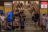 People take shelter in an underground station in Kyiv during a Russian attack. The war has caused severe disruptions to education and family life, and mental health issues are widespread (Picture: Roman Pilipey)