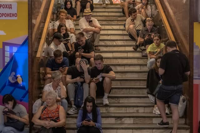 People take shelter in an underground station in Kyiv during a Russian attack. The war has caused severe disruptions to education and family life, and mental health issues are widespread (Picture: Roman Pilipey)