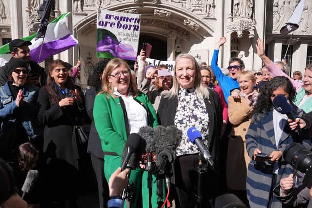 Susan Smith, centre left, and Marion Calder, centre right, co-directors of For Women Scotland with campaigners celebrate outside the Supreme Court in London after the ruling on the legal definition of a woman.