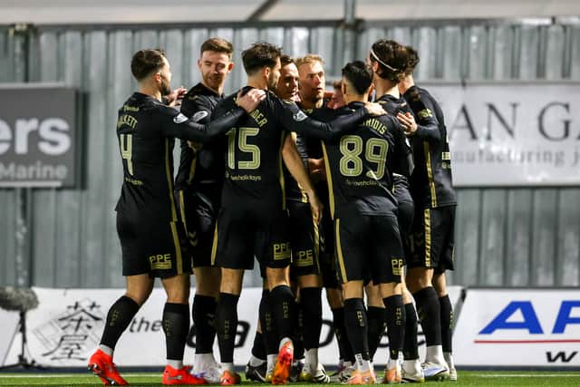 Hearts players celebrate the early opener against Falkirk by Claudio Braga.
