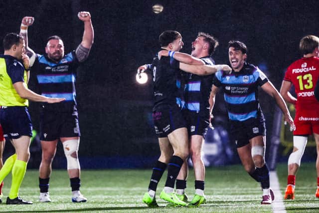 The Glasgow Warriors players celebrate their huge win over Toulouse.