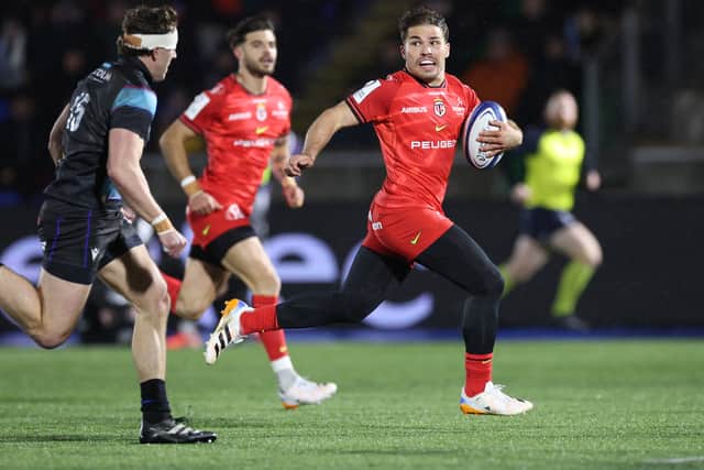 Antoine Dupont of Toulouse runs through to scores his team's opening try during the Investec Champions Cup match against Glasgow Warriors.
