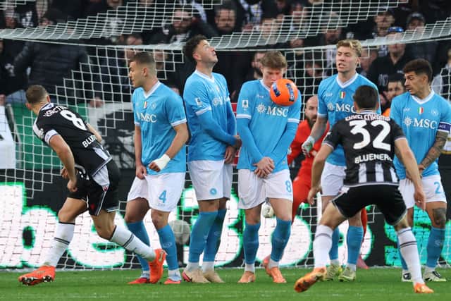 Napoli's Scott McTominay takes a sore one in the face during the defeat by Udinese.
