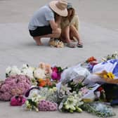 Flowers laid in memory of the victims of the mass shooting at Bondi Beach in Sydney on Sunday, in which 15 people, including a ten-year-old girl, were killed (Picture: David Gray)
