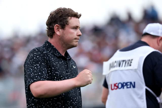 Bob MacIntyre reacts to holing a putt on the 18th green during the final round of the 125th US Open at Oakmont Country Club