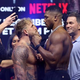 Jake Paul faces off against Anthony Joshua during the weigh-in for their fight. 