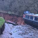 One boat can be seen teetering over the edge of a drop