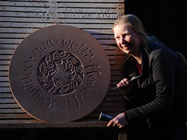 Stonemason Jennie Regan puts the finishing touches to the floor centerpiece for the Nature Observation Station part of the Building Craft Programme at Dumfries House estate which is part of The King's Foundation near Cumnock, Ayrshire.