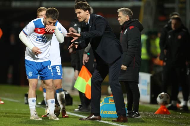 Rangers head coach Danny Rohl issues instructions to Nicolas Raskin.