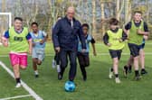 John Swinney at a community football facility in Castlemilk, Glasgow, in November