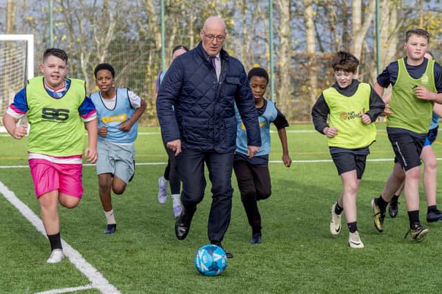 John Swinney at a community football facility in Castlemilk, Glasgow, in November