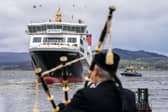 A piper plays at the launch of the Glen Rosa ferry in April 2024. It's not currently expected to be ready to start carrying passengers until late 2026 (Picture: Jane Barlow)