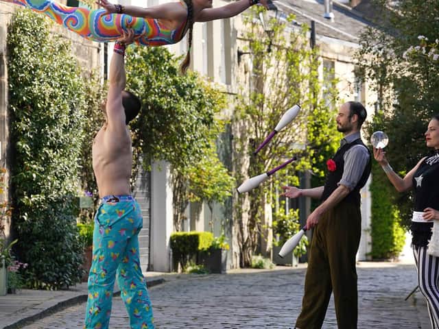 Circus acts perform in Edinburgh's Circus Lane (Picture: Andrew Milligan)