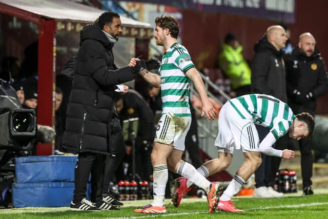 Celtic manager Wilfried Nancy (left) shakes the hands of Anthony Ralston as he is substituted during the 2-0 defeat by Motherwell at Fir Park. (Photo by Craig Williamson / SNS Group)