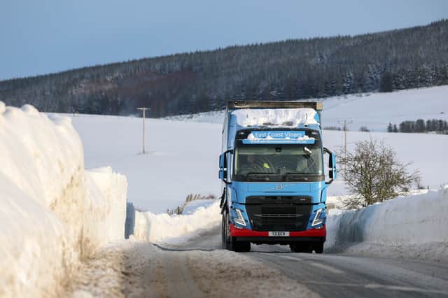 Vehicles drive along the A97 on in Rhynie, Aberdeenshire, on Tuesday