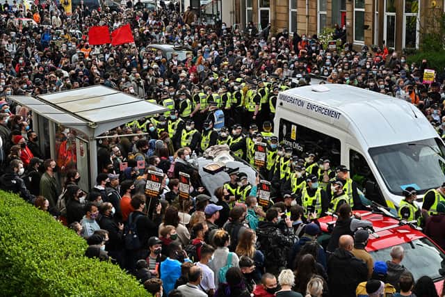 A large crowd of people in Glasgow's Kenmure Street prevented efforts to deport two men (Picture: Jeff J Mitchell)