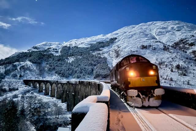 A West Coast Railways locomotive on snow patrol on the Glenfinnan Viaduct on the Fort William-Mallaig line