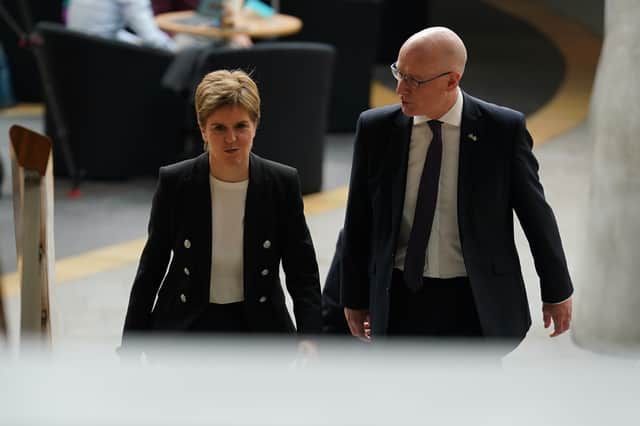 Nicola Sturgeon and John Swinney in the Scottish Parliament