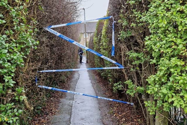 A path off Drum Brae Drive in Edinburgh has been cordoned off by police.