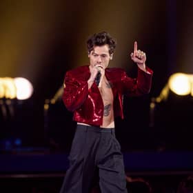 Harry Styles appears to be teasing new music as cryptic posters begin appearing around the world. 